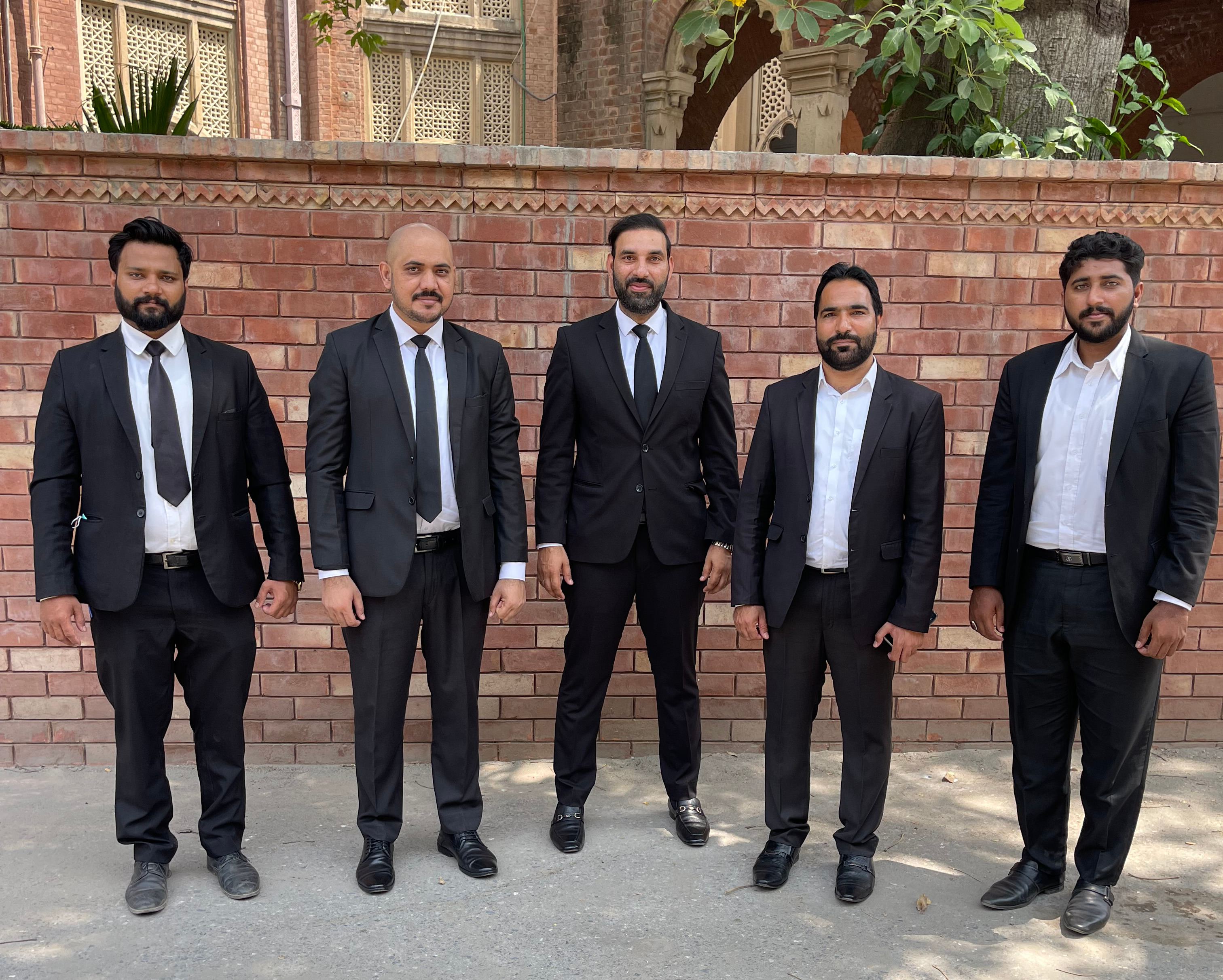 Young Pakistani lawyer standing outside court
