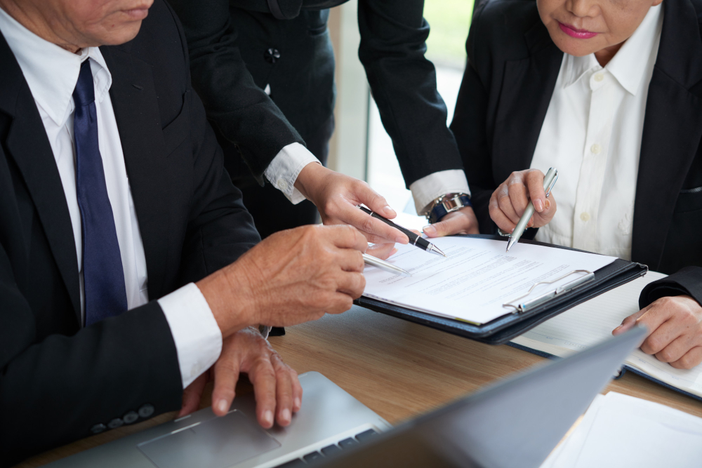 Lawyer reviewing documents during online consultation